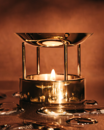 Solid brass oil burner styled in a warm minimal interior